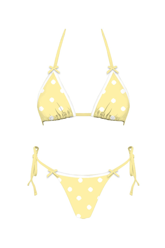 Yellow polka dot bikini set on a white background
