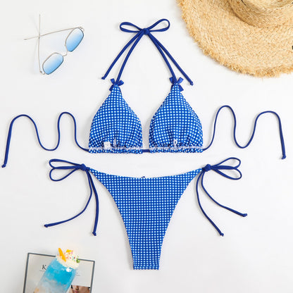 Blue and white gingham bikini set with matching accessories on a white background