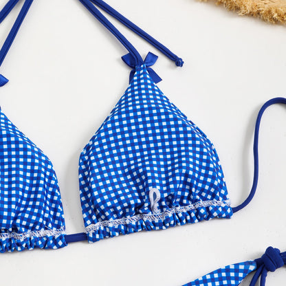 Blue and white gingham bikini top on a white background