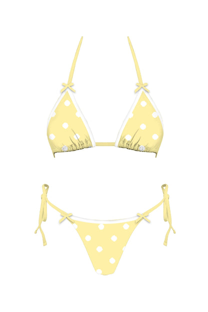 Yellow polka dot bikini set on a white background